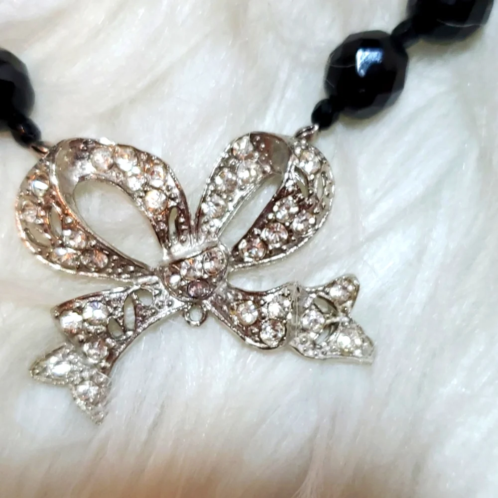 Boutique black, silver tone with a bling bow necklace